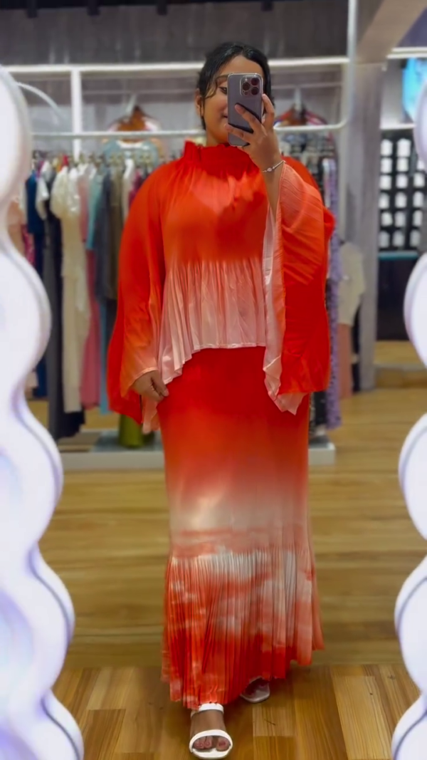 "Fiery Ombre Red to Peach Pleated Maxi Co-Ord Set with Flowing Cape Sleeves and High Ruffled Neck – Luxe Crepe Satin Blend with Fluid Movement for Festive, Resort, or Statement Wear 🌅👑"